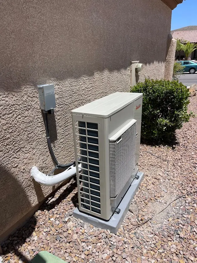 Residential air conditioning condenser unit in Sunnyside